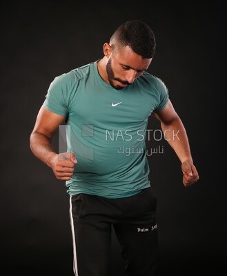 A man training on a black background