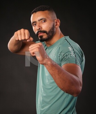 A man training on a black background