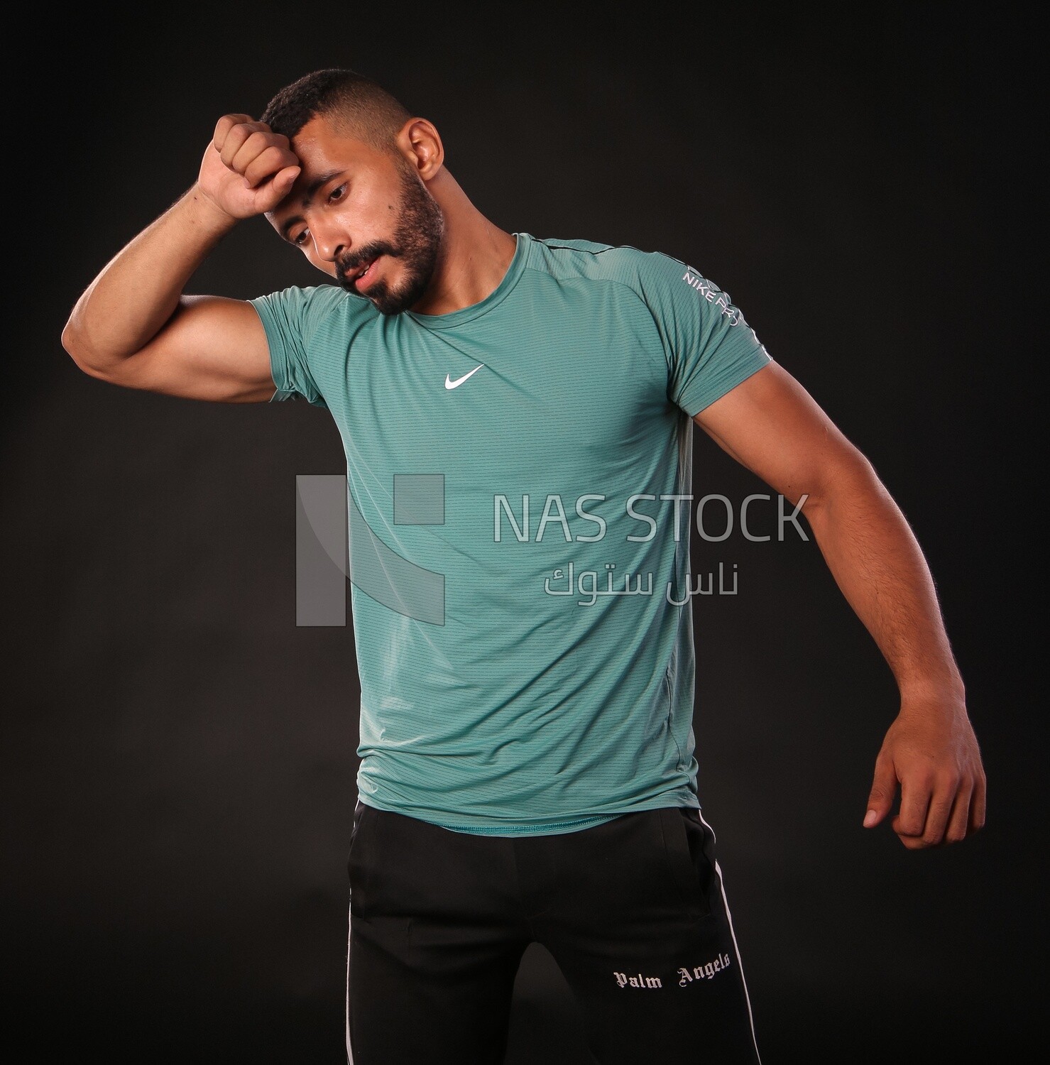 A man training on a black background