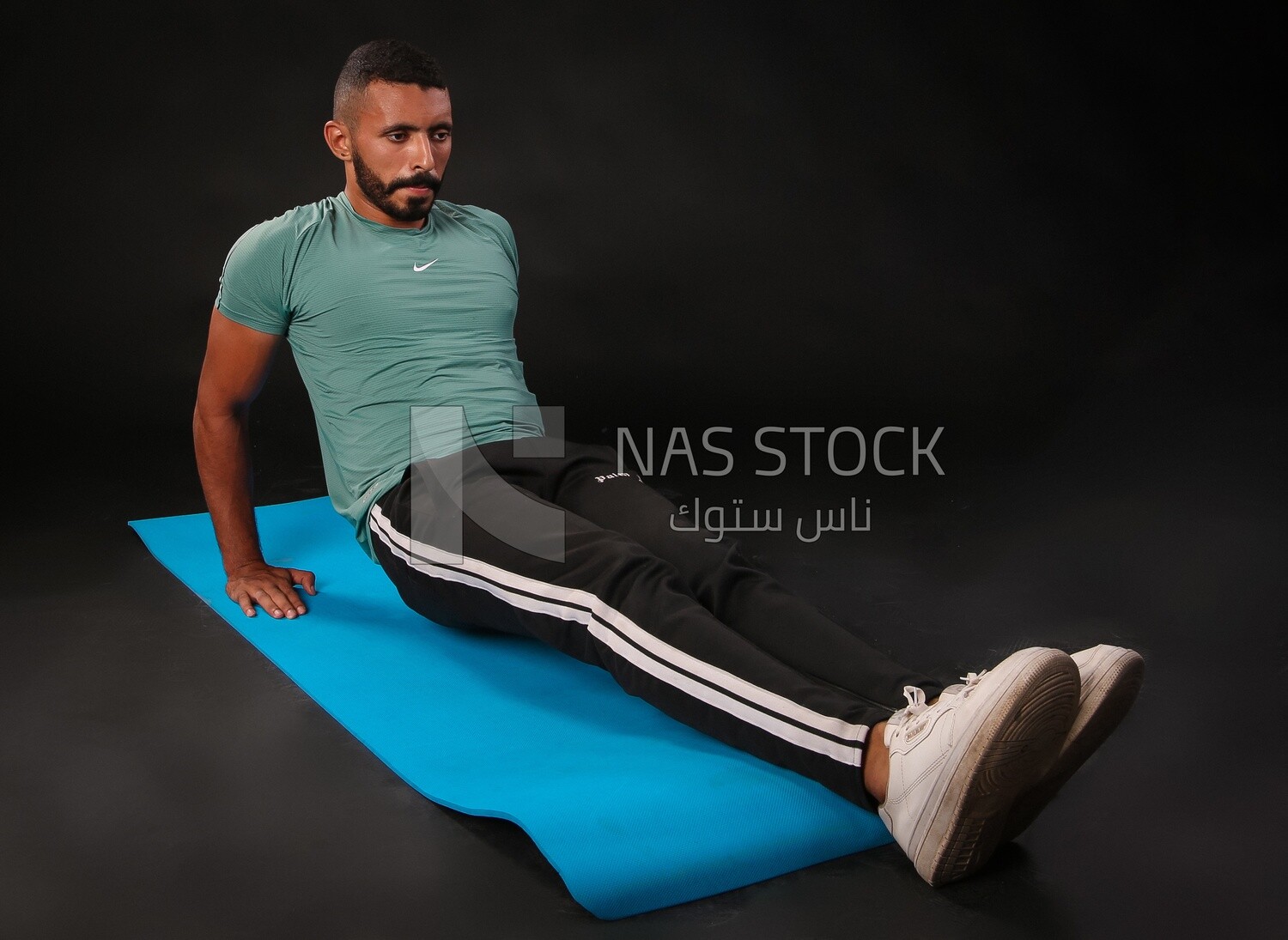 A man training on a black background