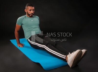 A man training on a black background