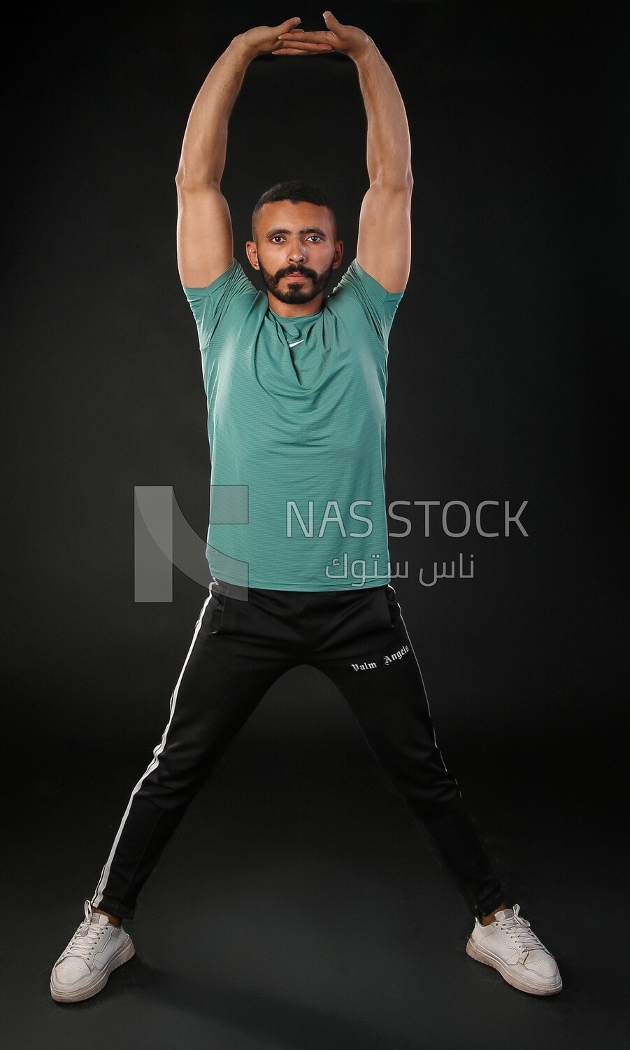 A man training on a black background