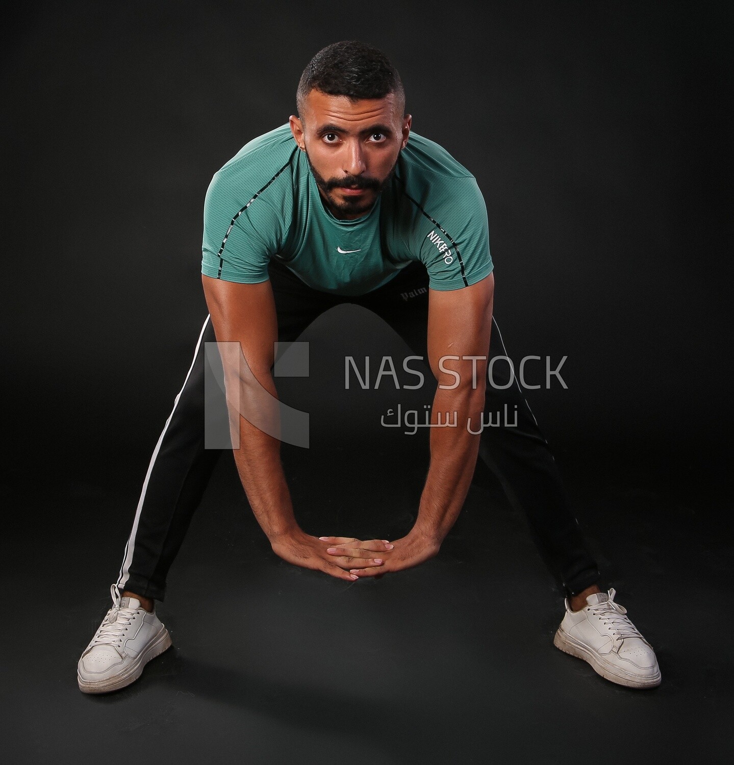 A man training on a black background