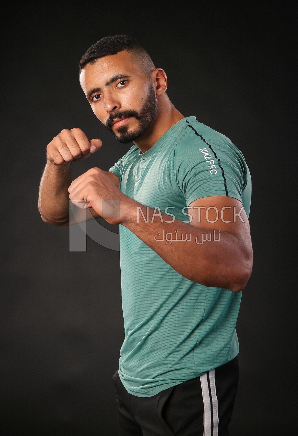 A man training on a black background