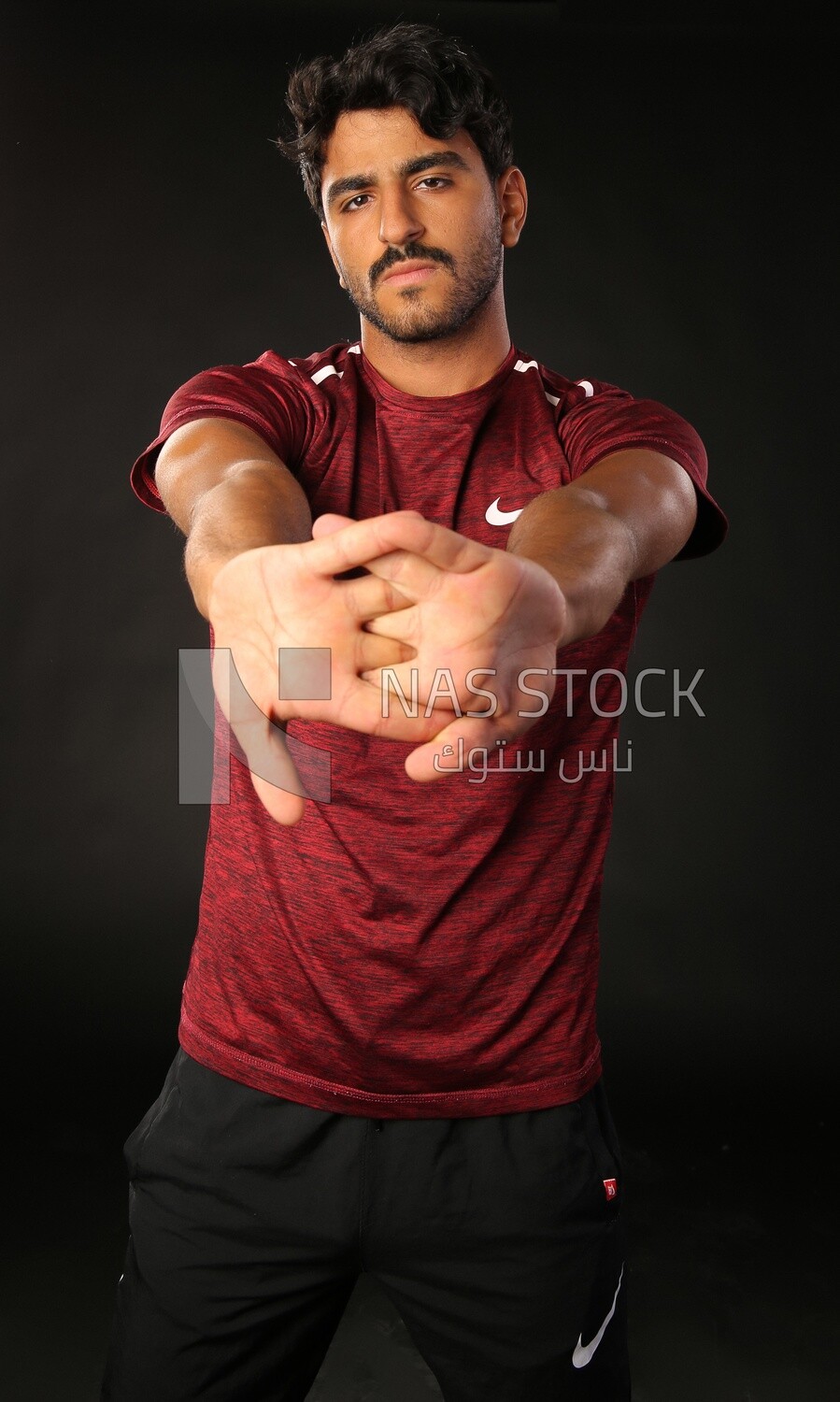 A man training on a black background