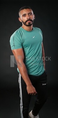 A man standing on a black background