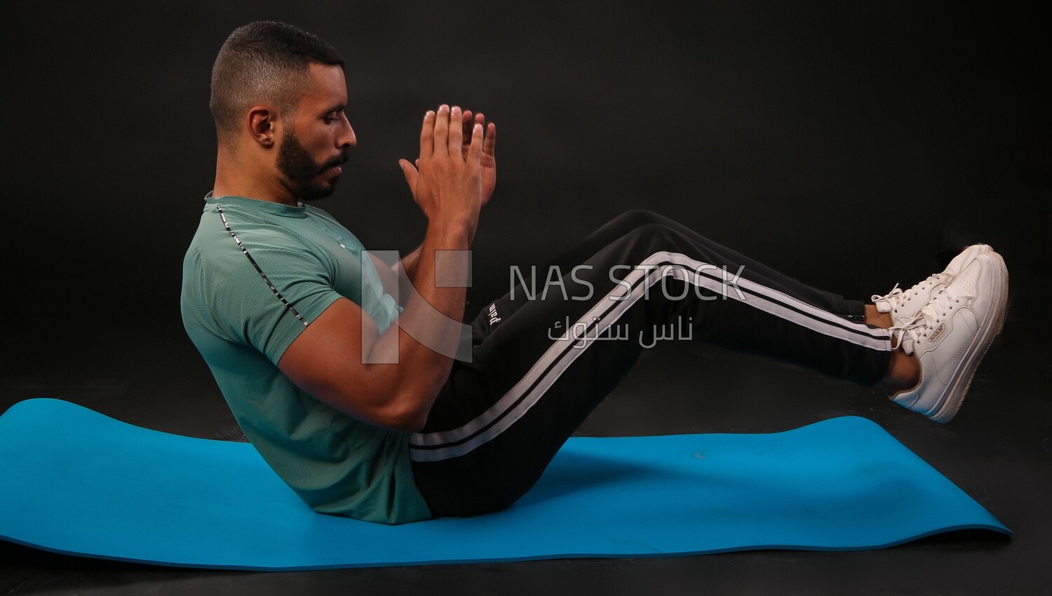 A man training on a black background