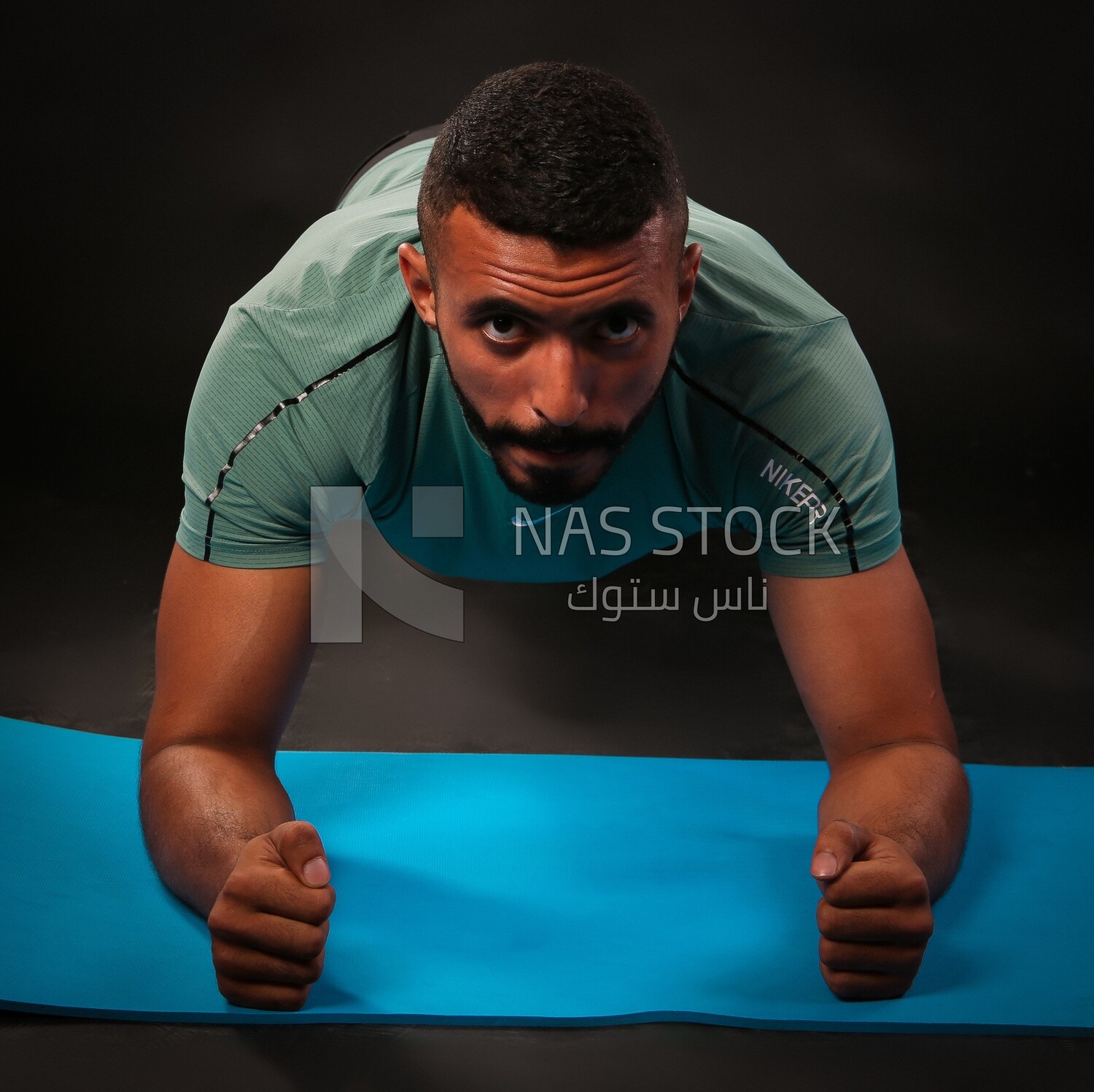 A man training on a black background