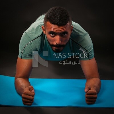 A man training on a black background