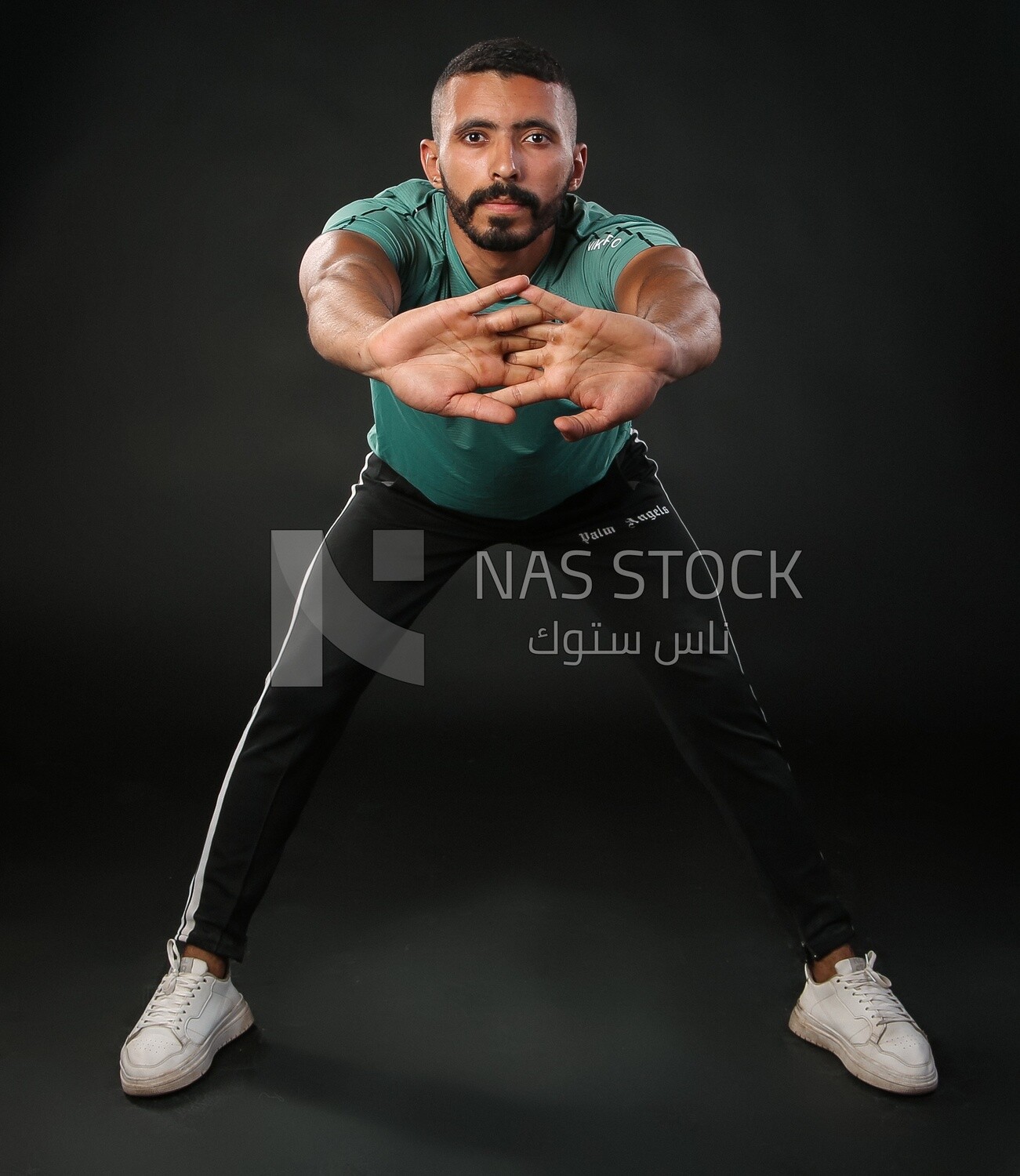 A man training on a black background