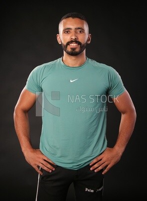 A man standing on a black background