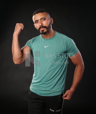 A man standing on a black background