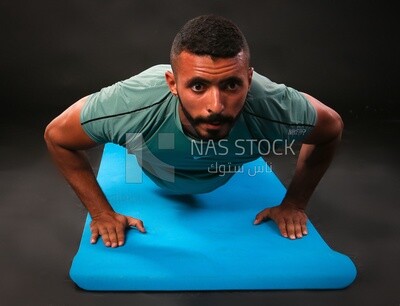 A man training on a black background