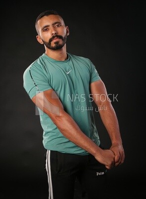 A man standing on a black background
