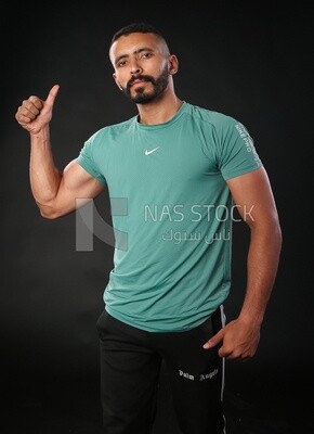 A man standing on a black background