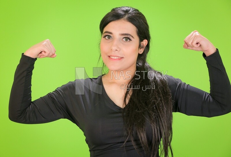 A woman looking at her muscles