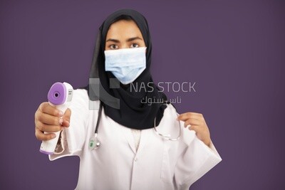 A woman doctor wearing a black hijab
