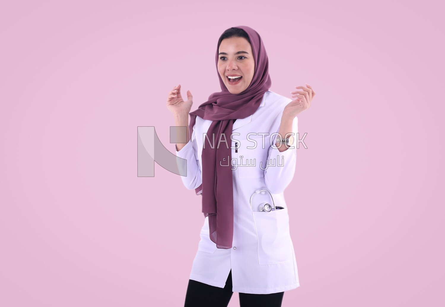 A woman doctor wearing a black hijab