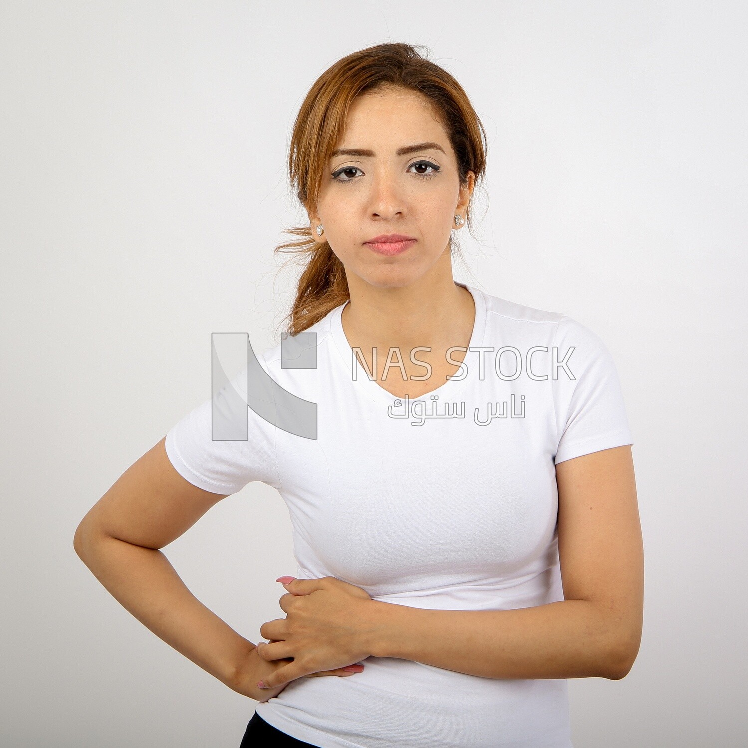 A woman wearing sportswear on a white background