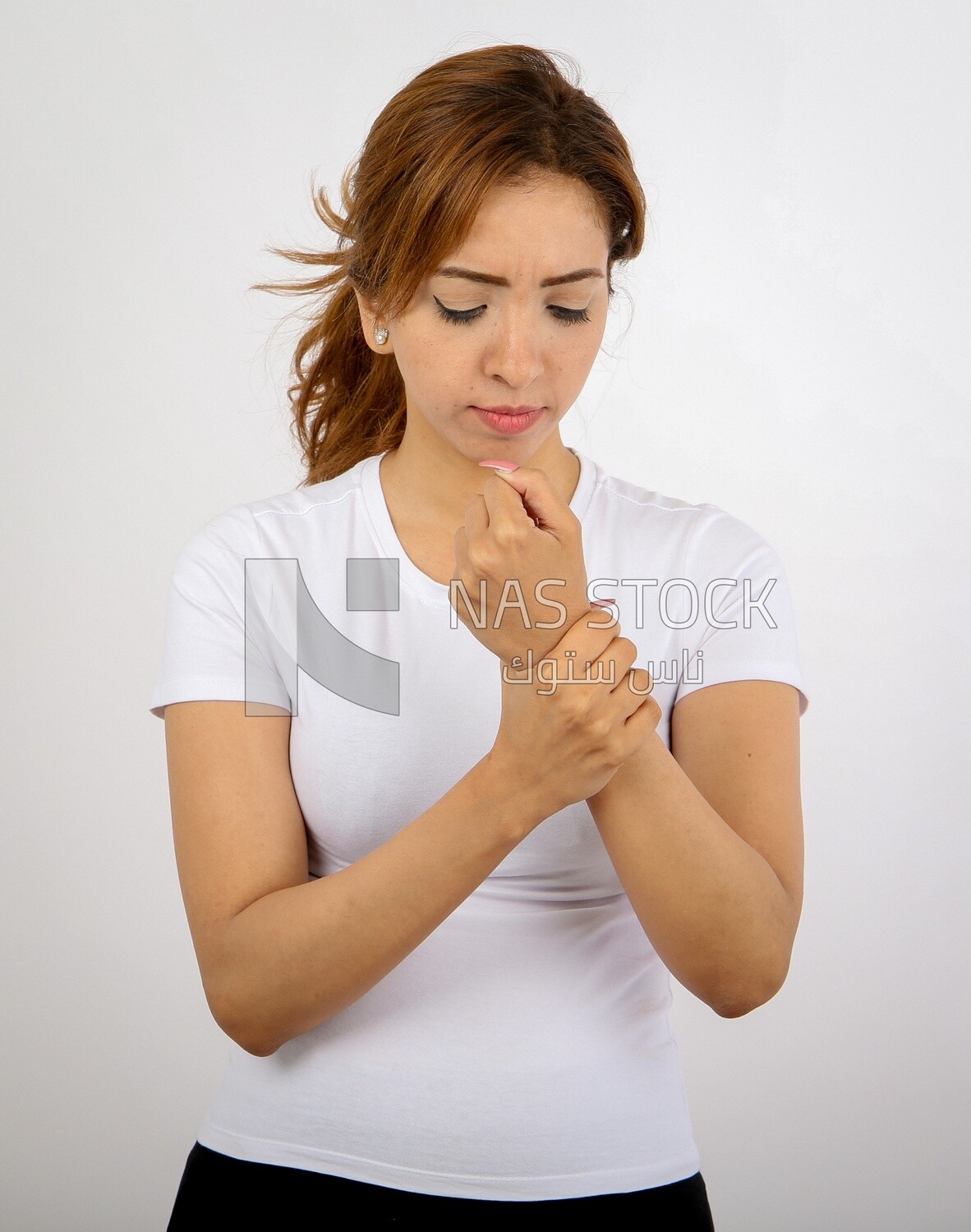 A woman wearing sportswear on a white background