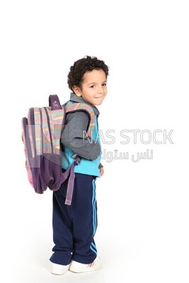 A boy wearing his bag on a white background