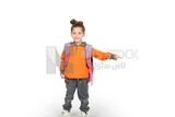 A schoolgirl wearing her bag and pointing