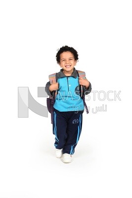 A boy wearing his bag on a white background