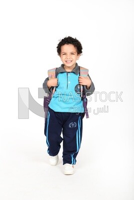 A boy wearing his bag on a white background
