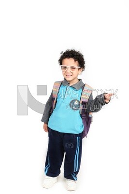 A boy wearing his bag on a white background