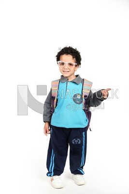 A boy wearing his bag on a white background