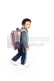 A boy wearing his bag on a white background