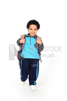 A boy wearing his bag on a white background