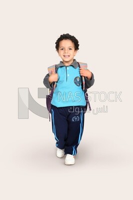 A boy wearing his bag on a white background