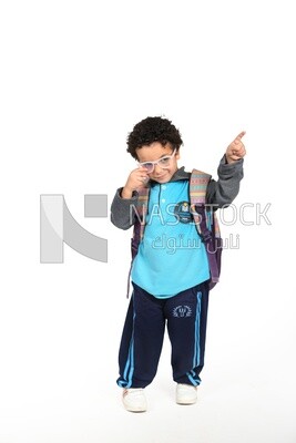 A boy wearing his bag on a white background