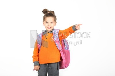 A schoolgirl wearing her bag and pointing