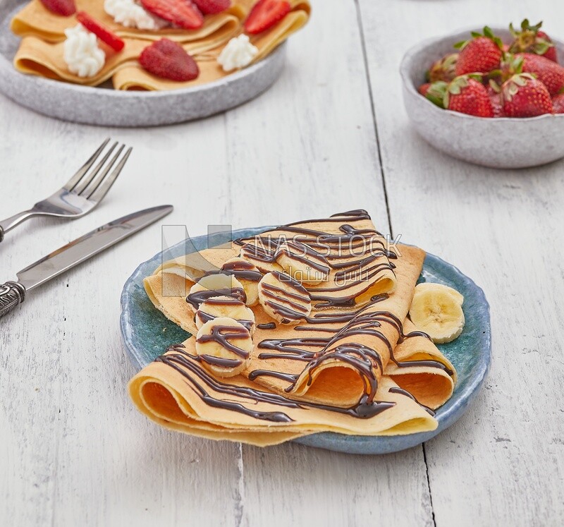 Chocolate crepe with banana slices