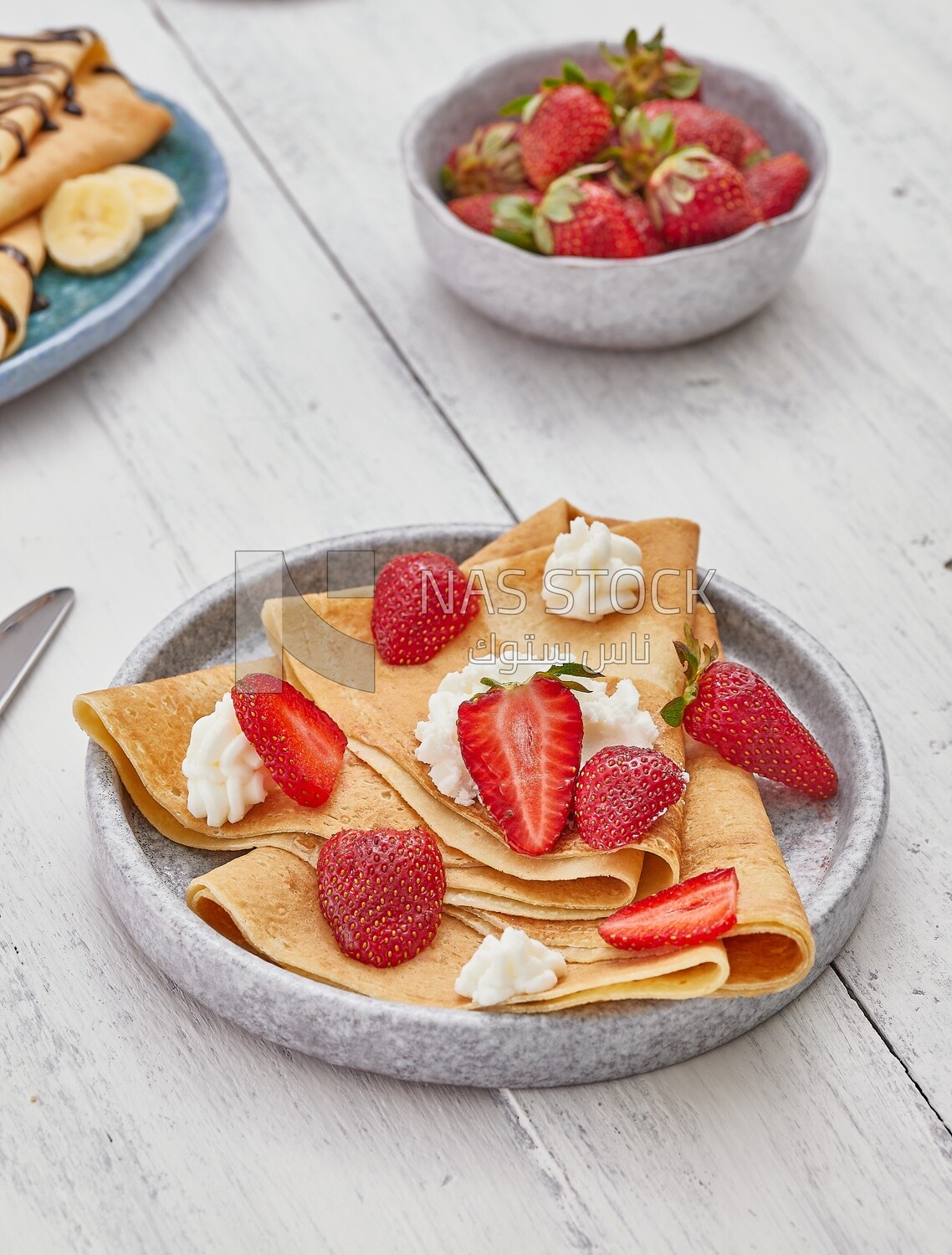 Dining table with a strawberry crepe