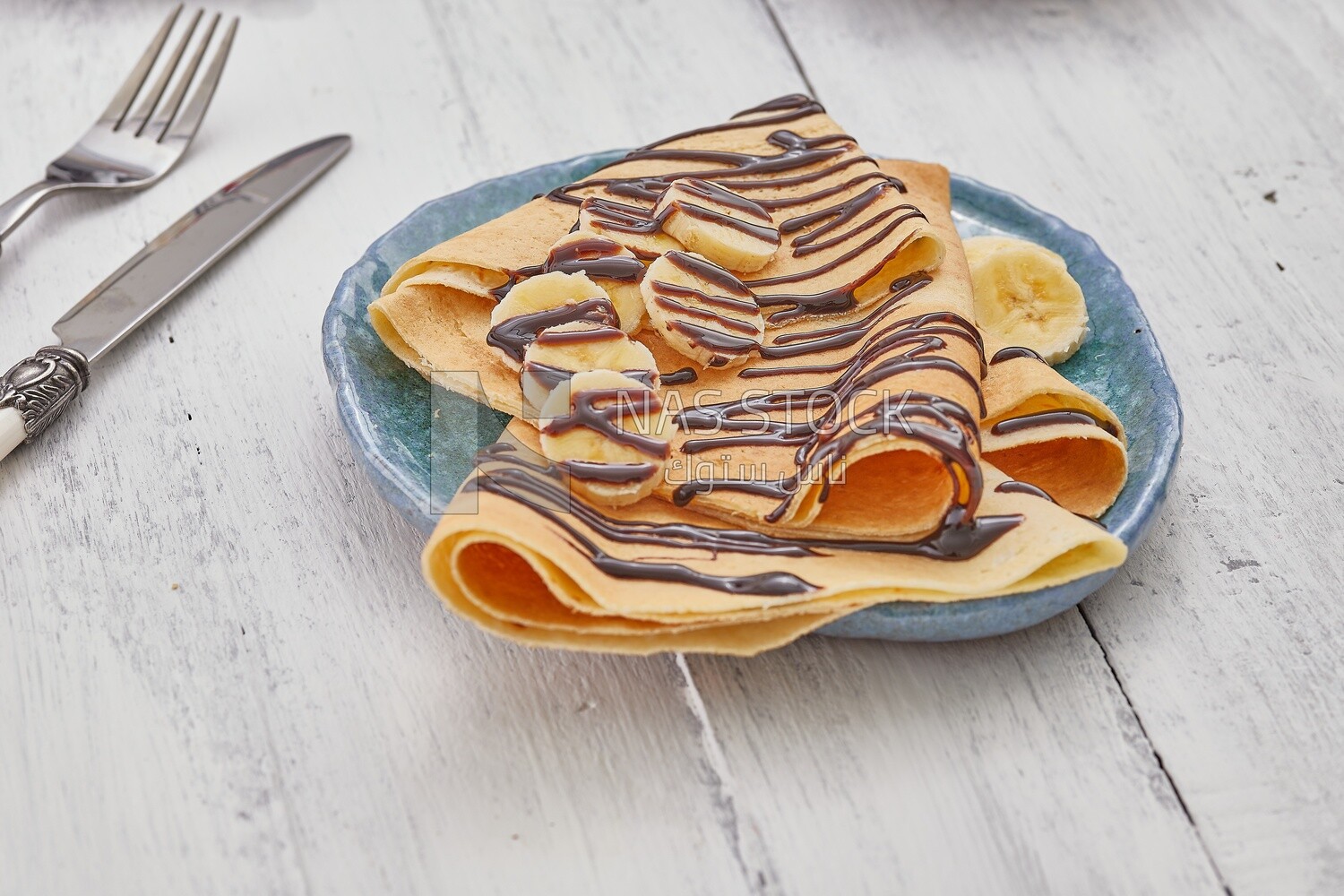 Chocolate crepe with banana slices