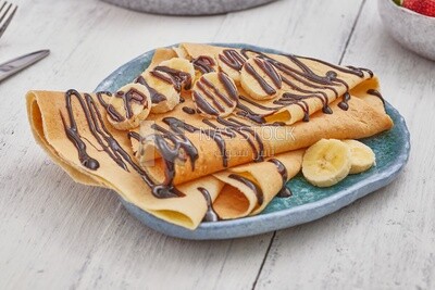 Chocolate crepe with banana slices