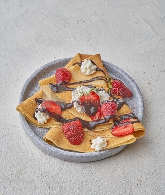 Strawberry crepe covered with chocolate on a solid background