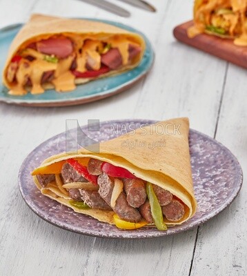 Sausage crepe with peppers and vegetables