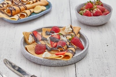 Strawberry crepe covered with chocolate and cream
