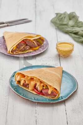 Smoked sausage crepe with melted cheese
