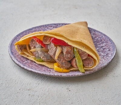 smoked sausage crepe on a solid background