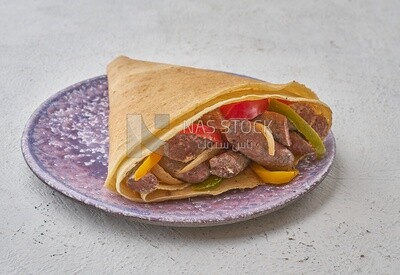Sausage crepe with peppers on a solid background
