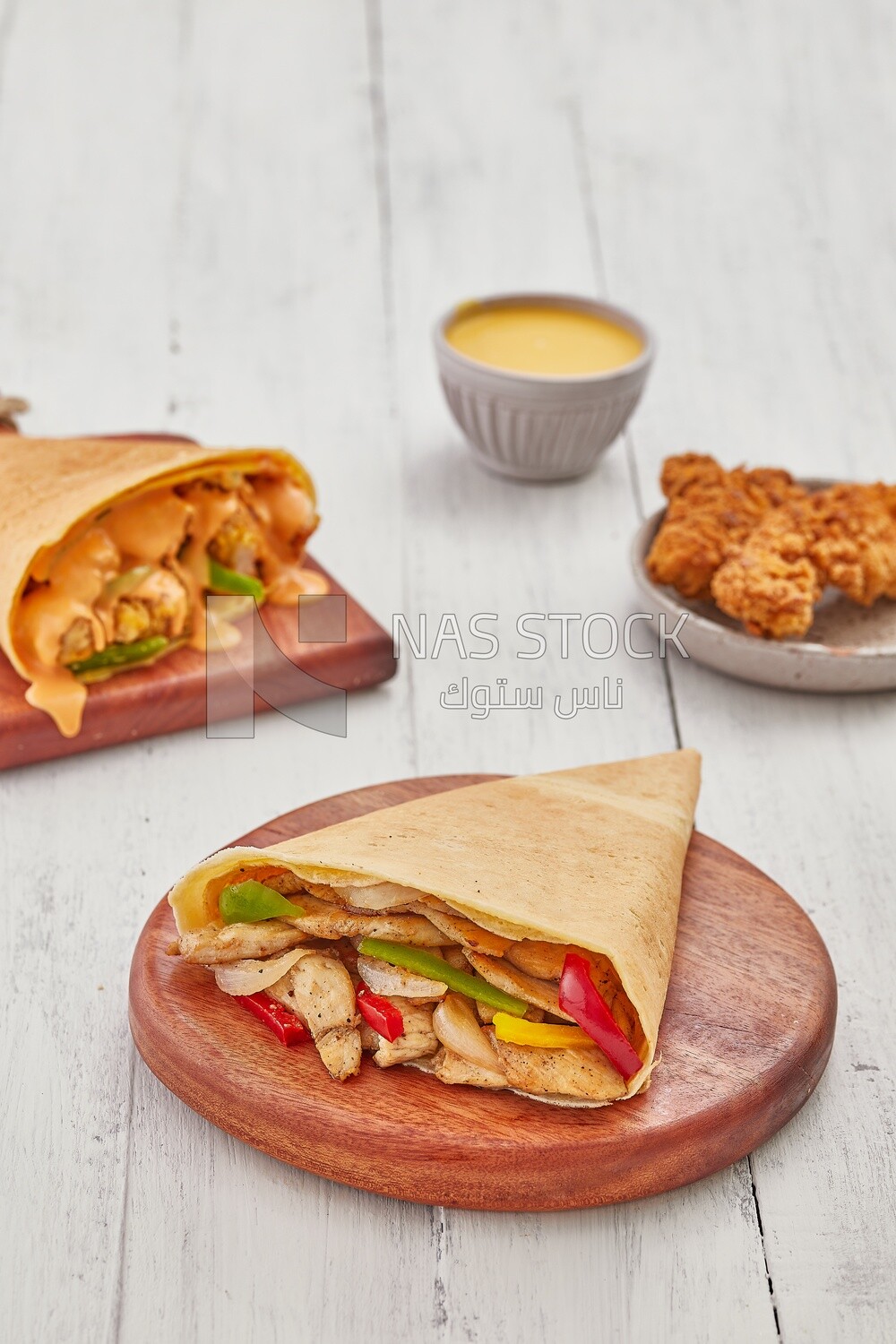 Chicken vegetable crepe with chicken crepe topped with melted cheese