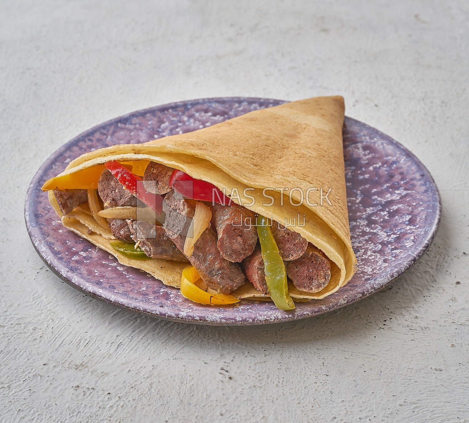 Sausage crepe with vegetables on a solid background