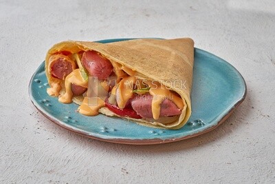 Smoked sausage crepe with melted cheese