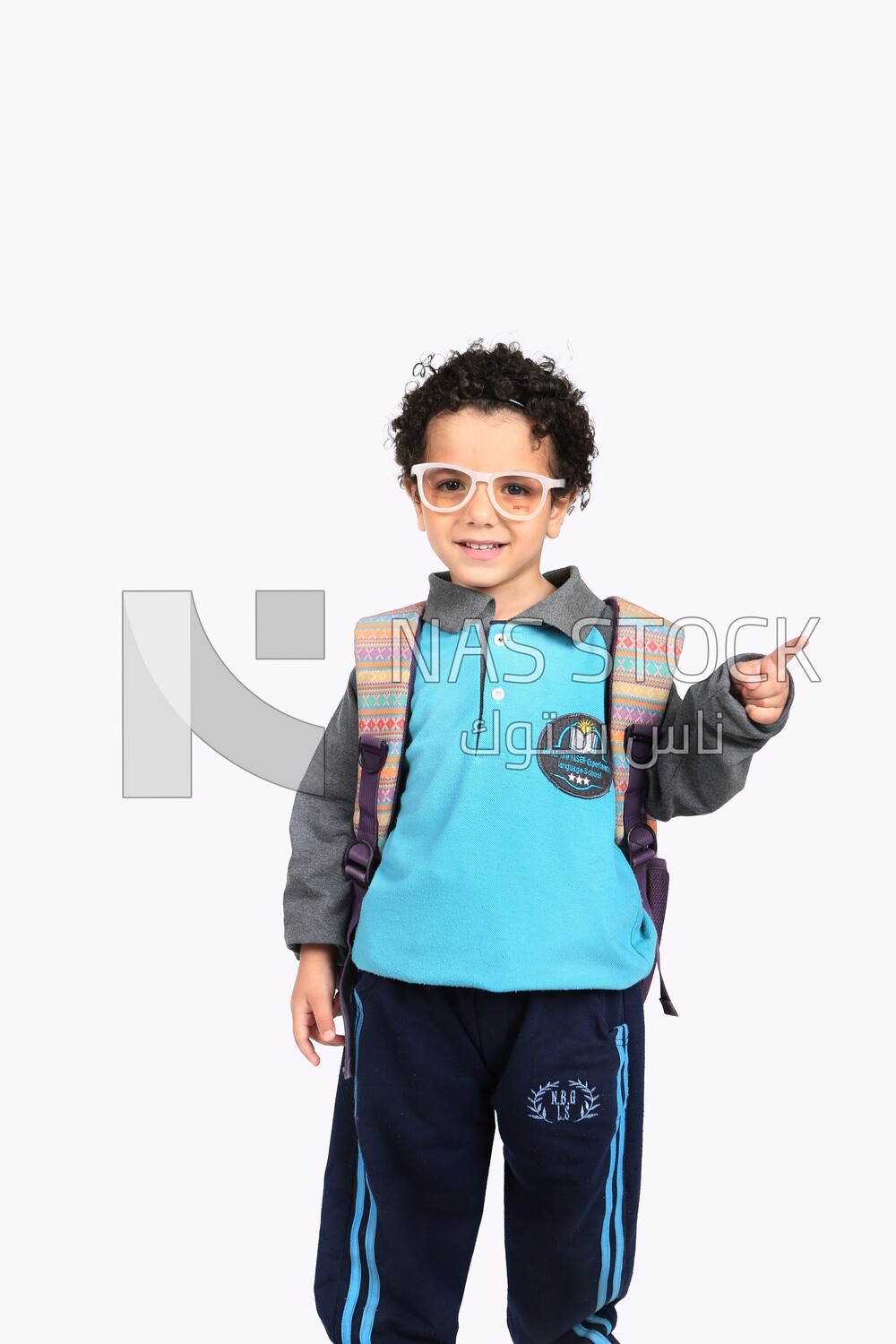 A boy wearing his bag