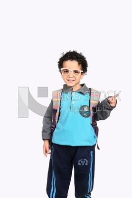A boy wearing his bag